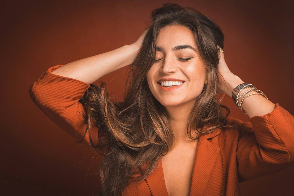 Woman installing Damage-Free Twists with relaxed hand positioning to minimize scalp tension